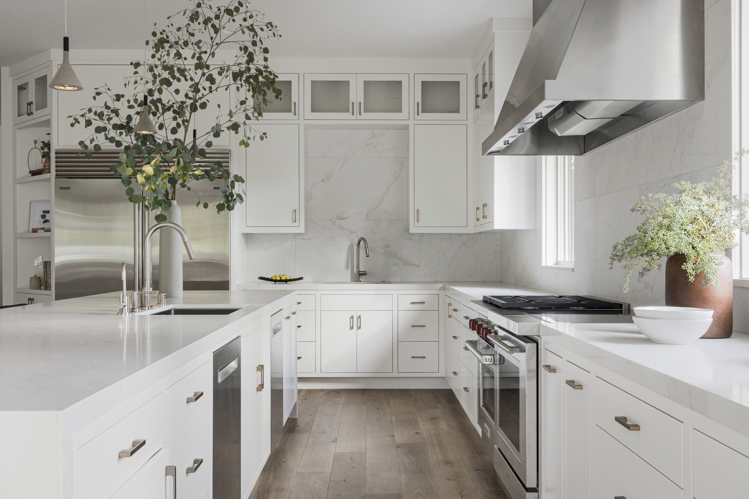 White bright kitchen with stainless steel appliances