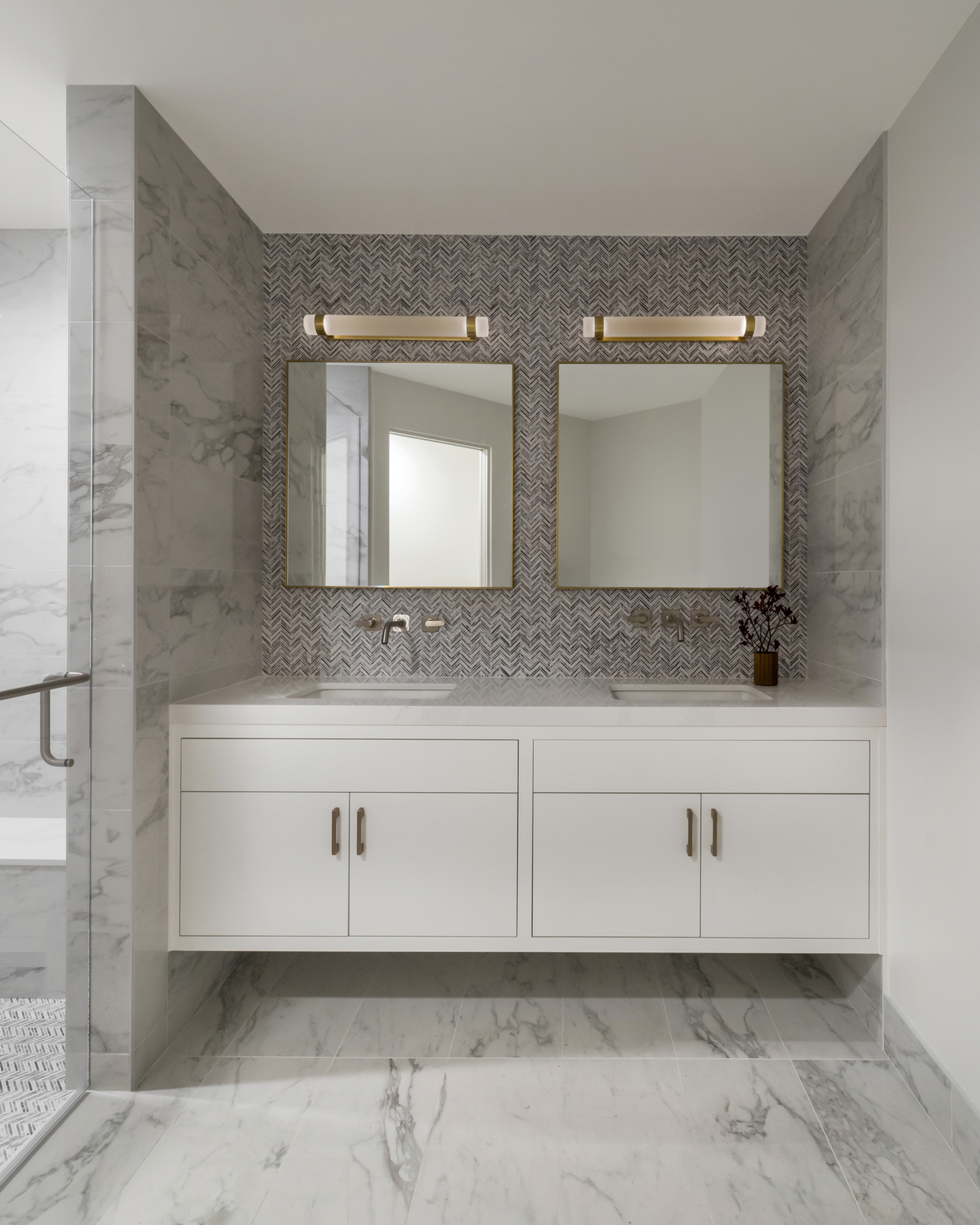 bathroom sink area with double sinks and mirrors