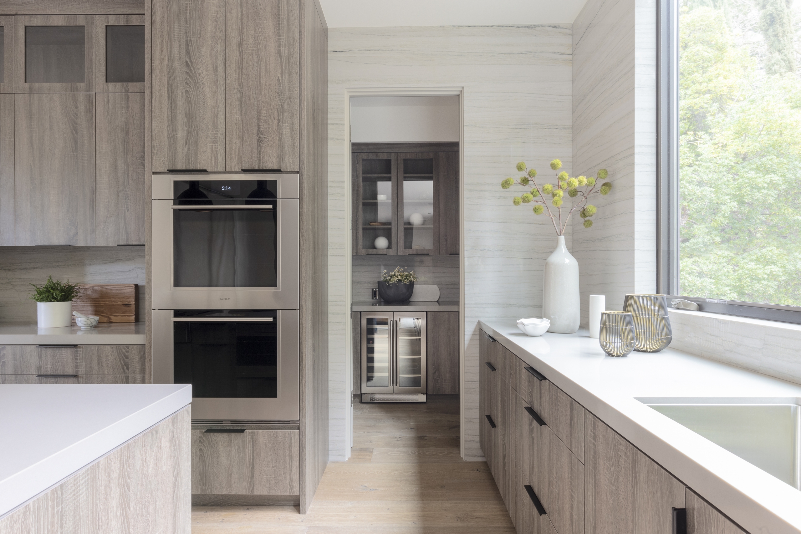 Modern kitchen pantry with double oven island