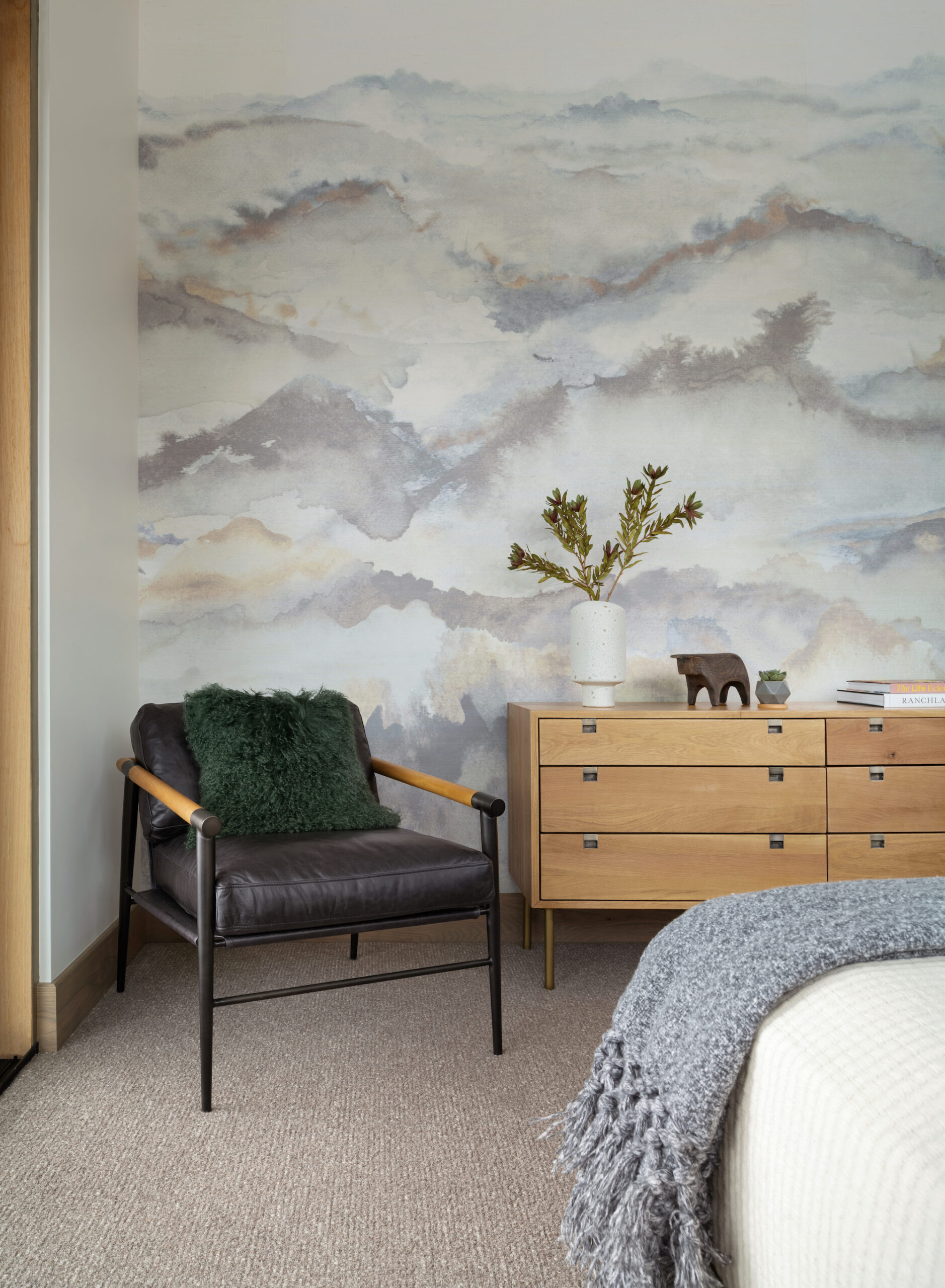 Guest bedroom with mountain wallpaper